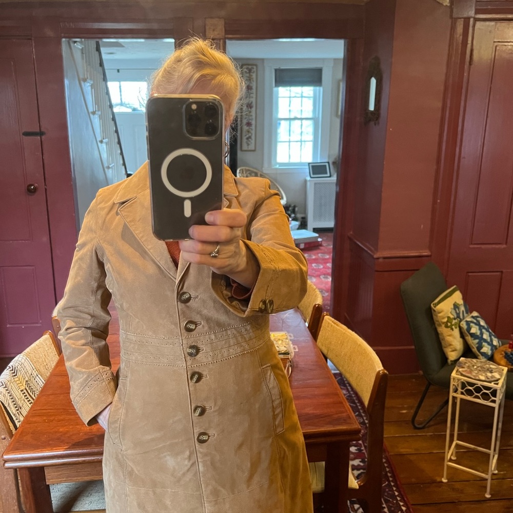 Suede coat new without tags. Excellent detail work, beautiful silk lining.